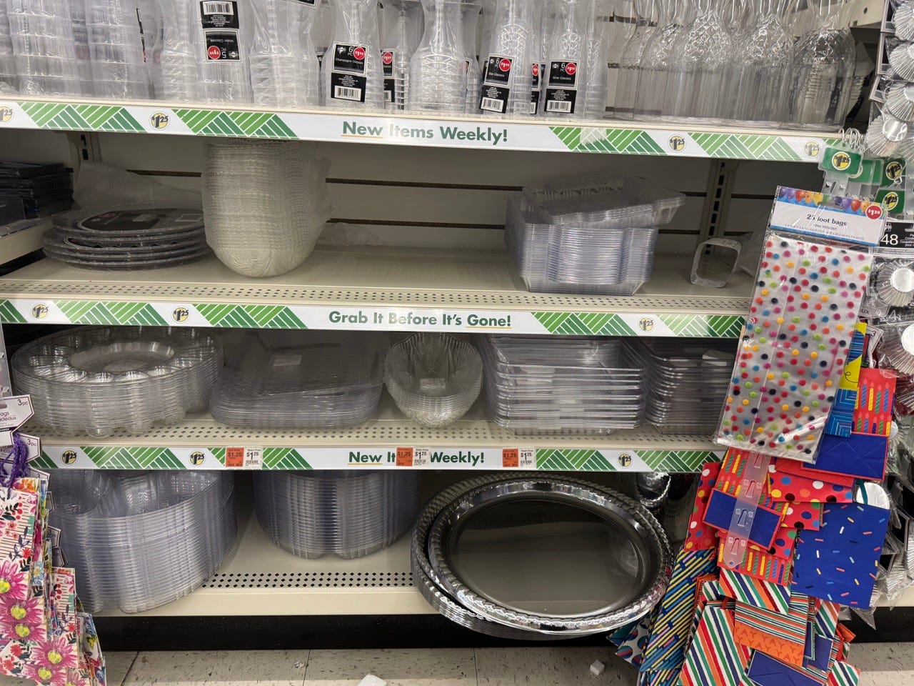 Plastic plates, cups in aisle at Dollar Tree