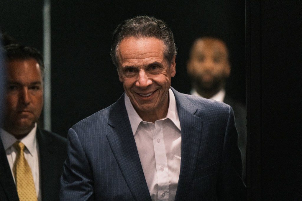 Andrew Cuomo smiling in a suit.