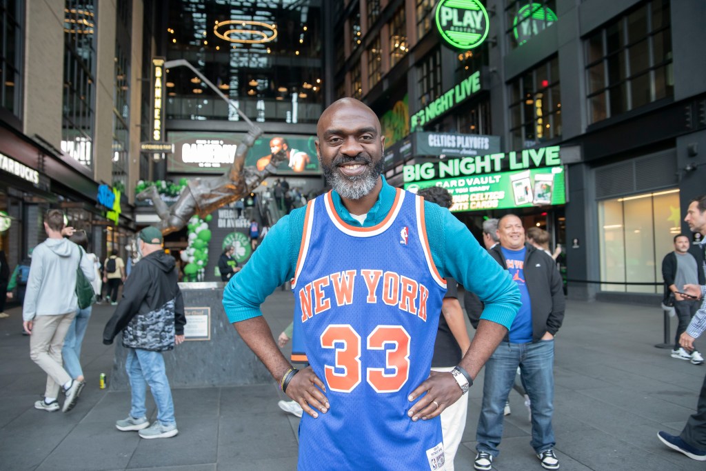 Michael Blake, Democratic candidate for NYC mayor, wearing a New York Knicks jersey outside TD Garden.