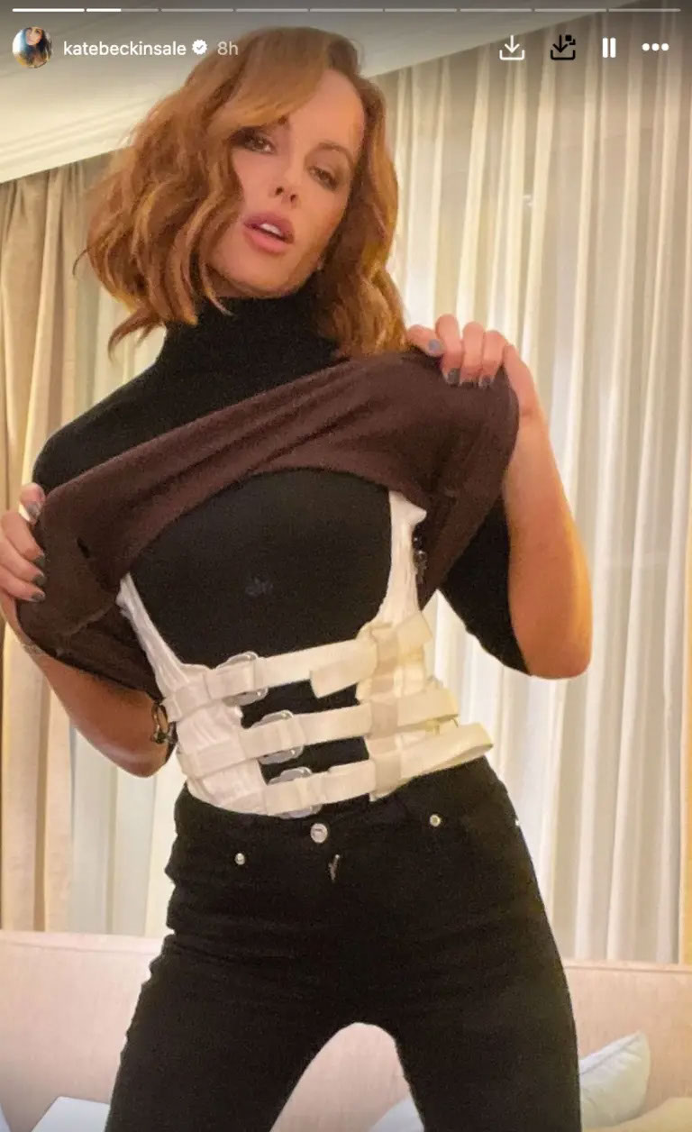 Kate Beckinsale wearing a back brace