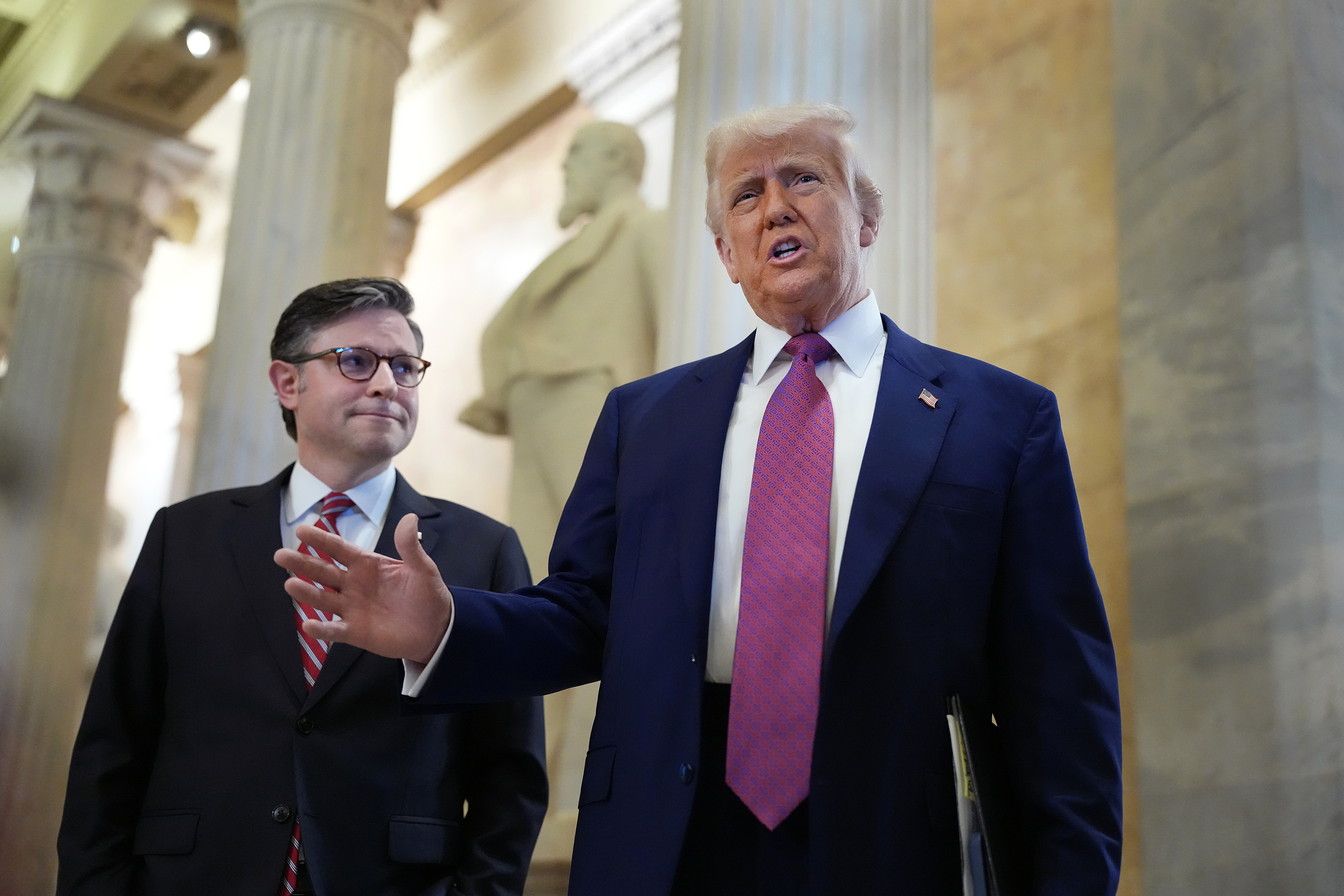 WASHINGTON, DC - MAY 20: President Donald Trump arrives with Speaker of the House Mike Johnson (R-LA) for a House Republican meeting at the U.S. Capitol on May 20, 2025 in Washington, DC. Trump will join conservative House lawmakers to help push through their budget bill after it advanced through the House Budget Committee on Sunday evening. (Photo by Kevin Dietsch/Getty Images)