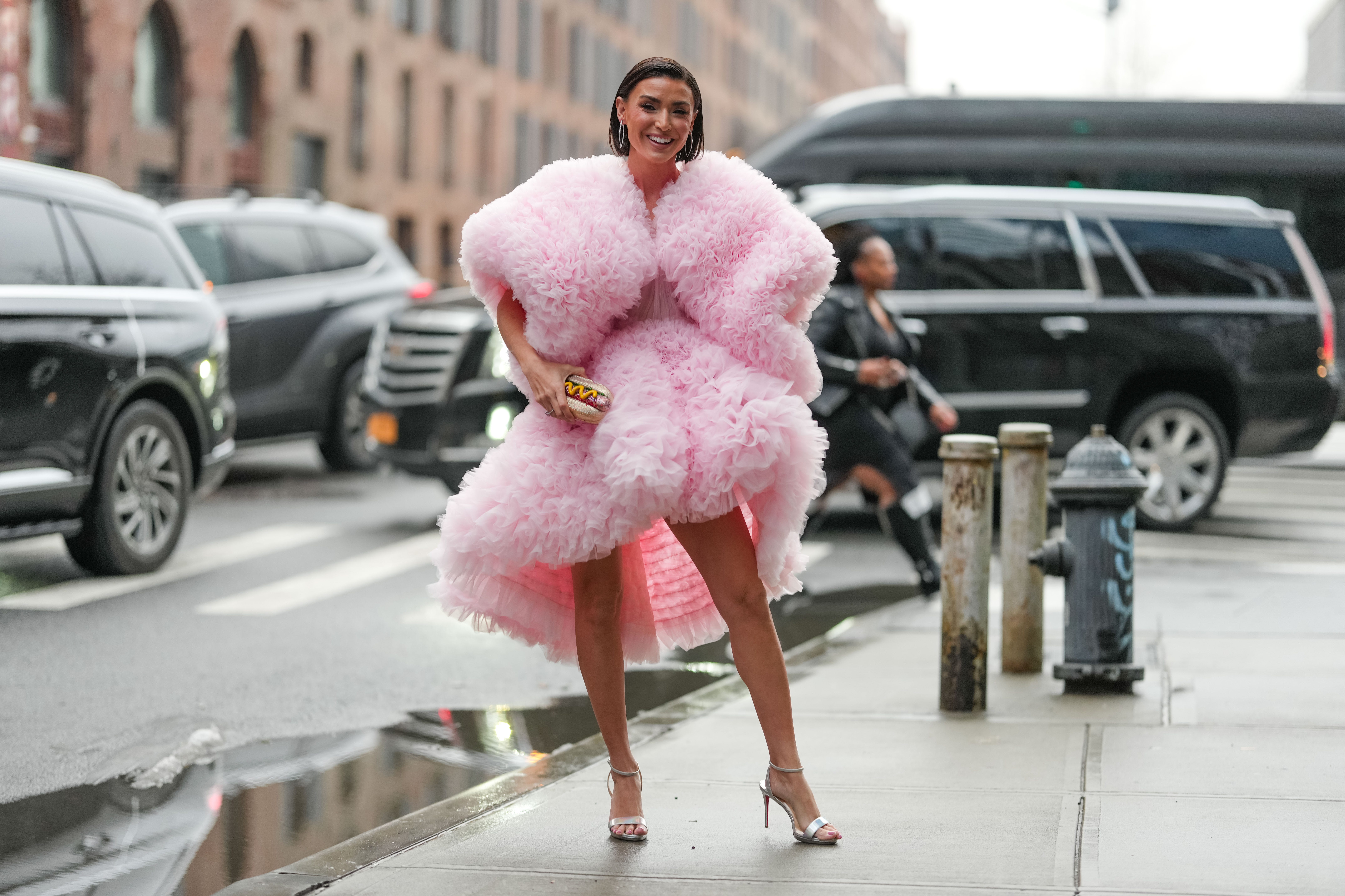 Reality star Bronwyn Newport carried a hot dog purse by Judith Leiber at New York Fashion Week in February 2025.