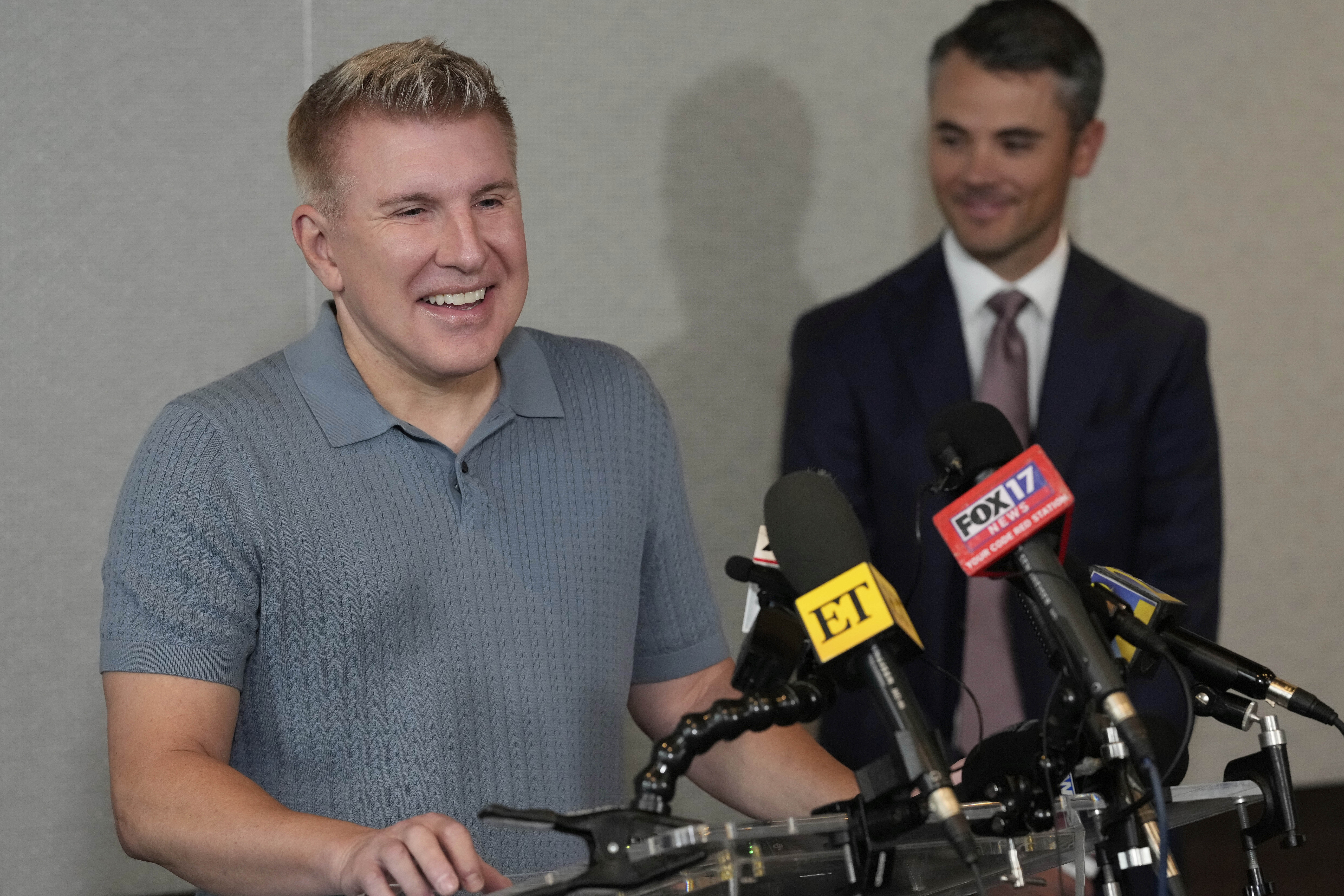 Todd Chrisley speaks at a podium. 