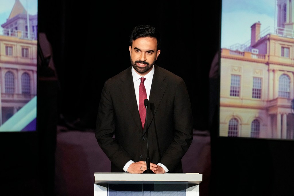 Zohran Mamdani speaking at a mayoral debate.