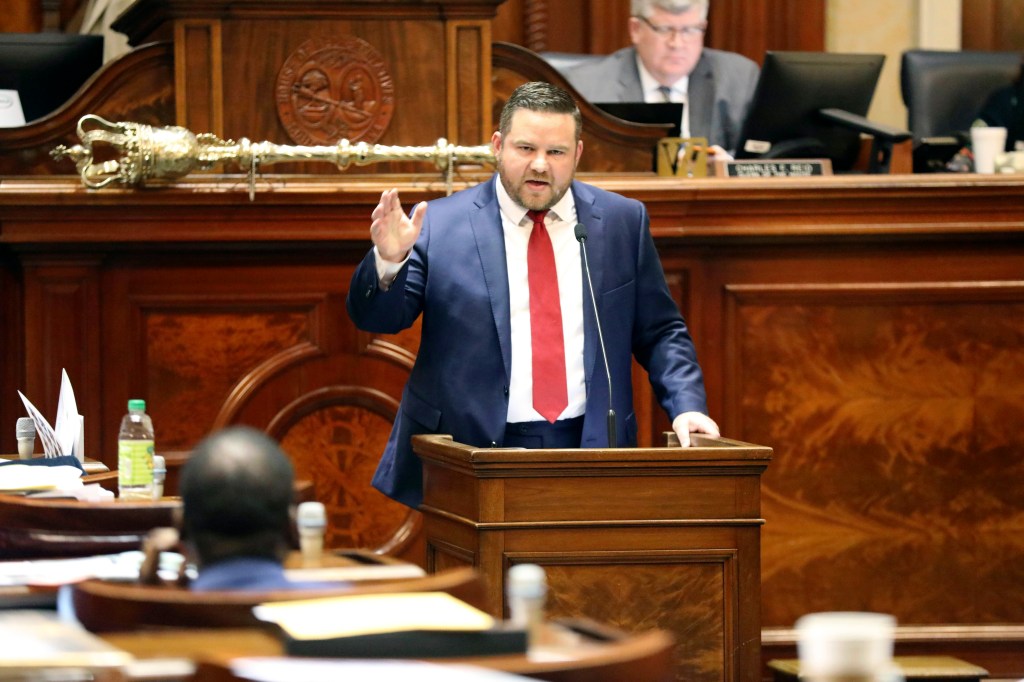 South Carolina Representative RJ May speaking at a podium.