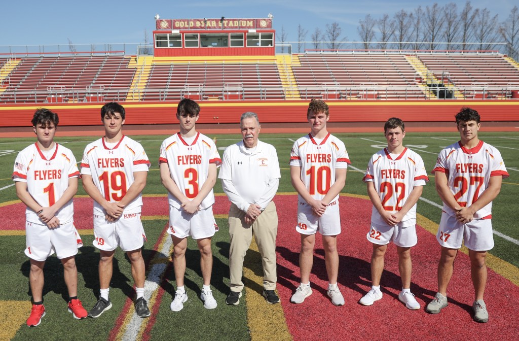 Jack Moran poses for a picture with some of his Chaminade players earlier in the season.