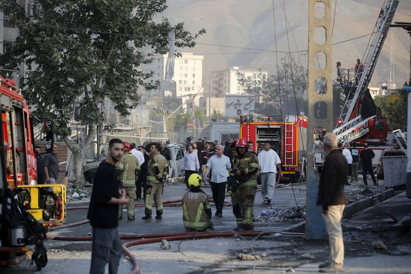 Emergency services attend to damage in Tehran