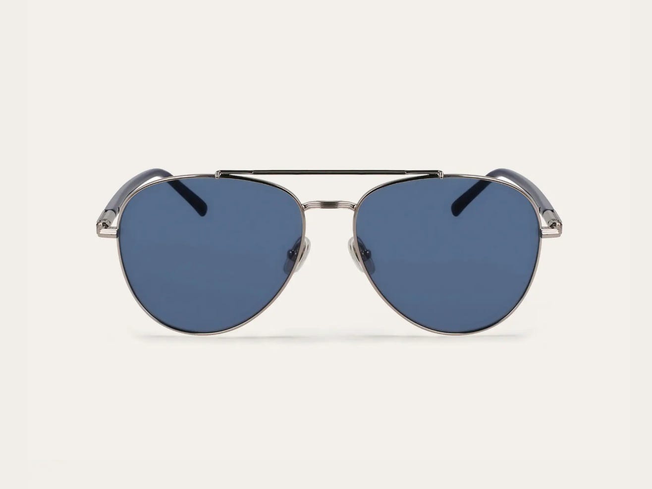 A pair of Ferragamo aviator glasses with blue lenses.