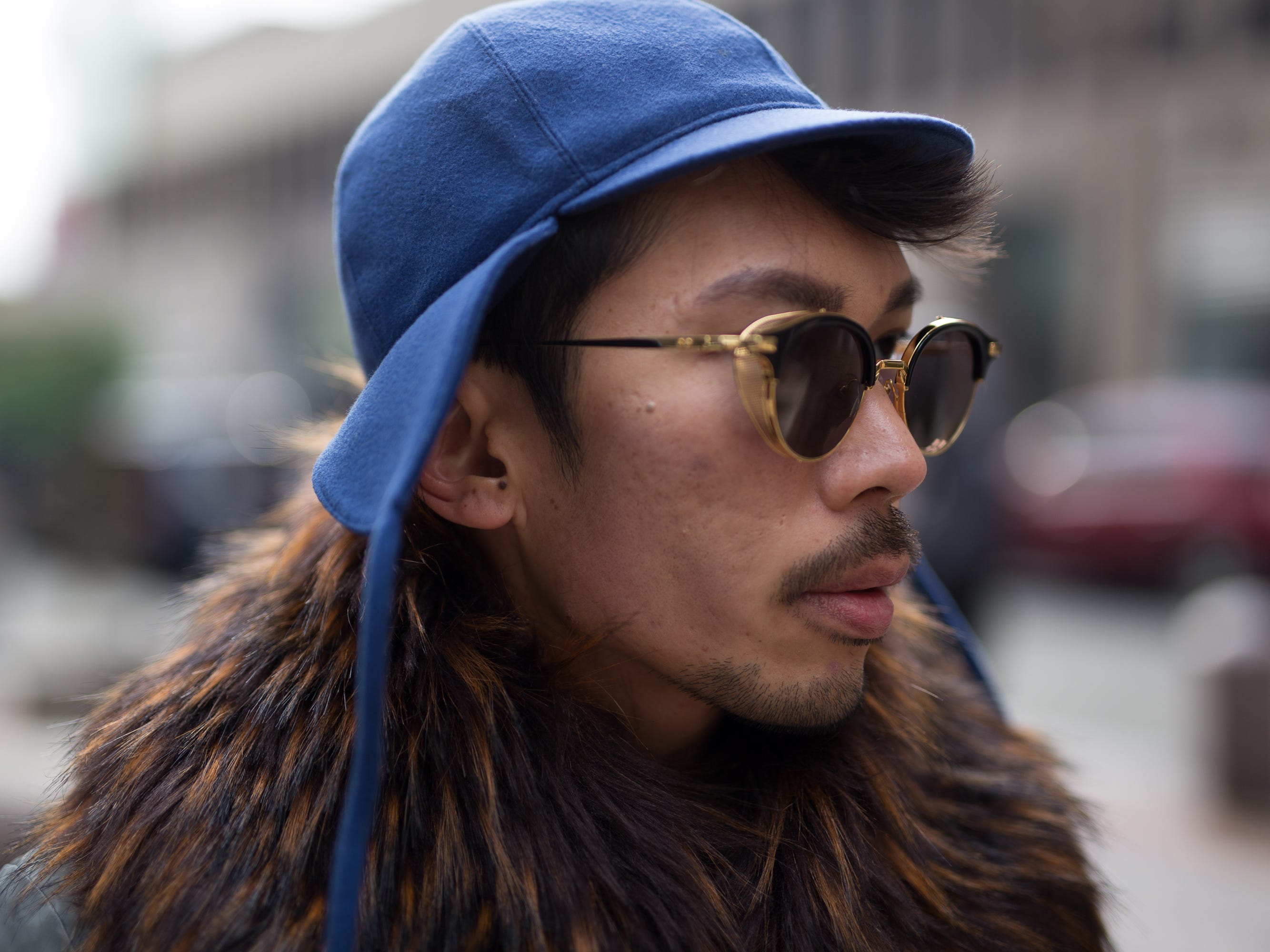 Henry Ng wears a blue hat and Gentle Monster glasses at New York Men's Day 2017.