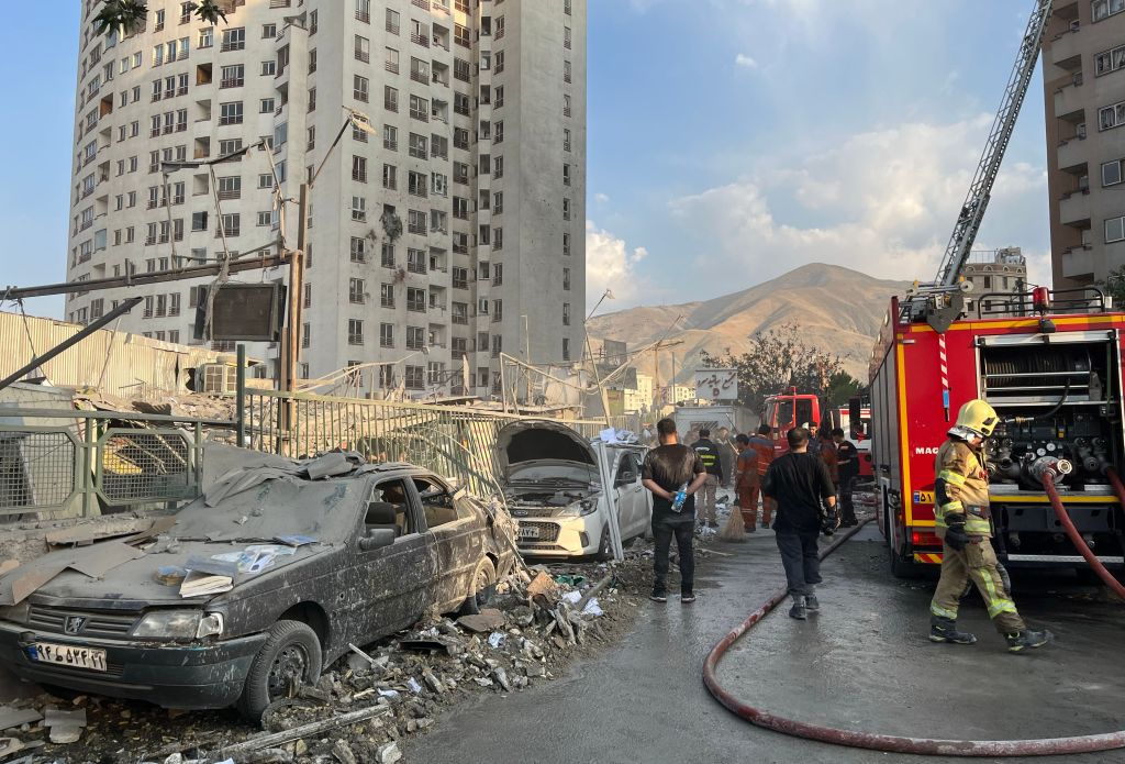Damage to buildings and cars following Israeli airstrikes in Tehran, Iran.