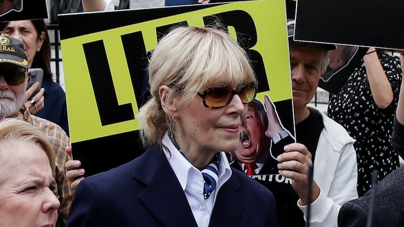 E. Jean Carroll (C) departs Manhattan federal appeals court following arguments in a judgement appeal brought by former US President Donald Trump, in New York City, September 6, 2024. Former US President Donald Trump was ordered on January 26, 2024 by a New York jury to pay $83 million in damages to Carroll, whom he publicly insulted and called a liar for alleging that he sexually assaulted her. The jury reached its decision after slightly less than three hours of deliberations. Trump made multiple comments about Carroll while he was president, demeaning her in the wake of her allegation of a 1990s assault. (Photo by Leonardo Munoz / AFP) (Photo by LEONARDO MUNOZ/AFP via Getty Images)