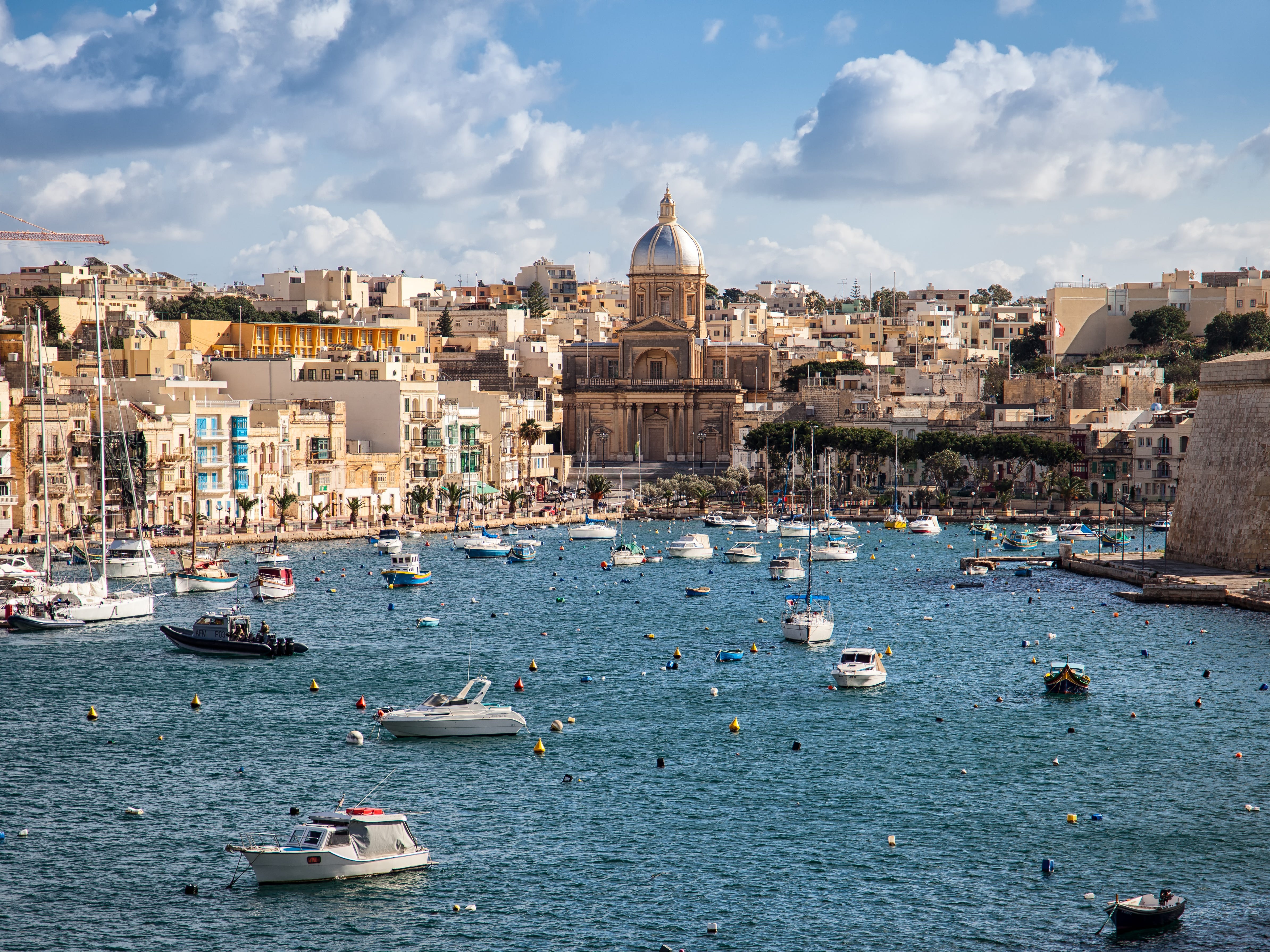 Sailing boats on Senglea marina in Grand Bay, Valetta, Malta