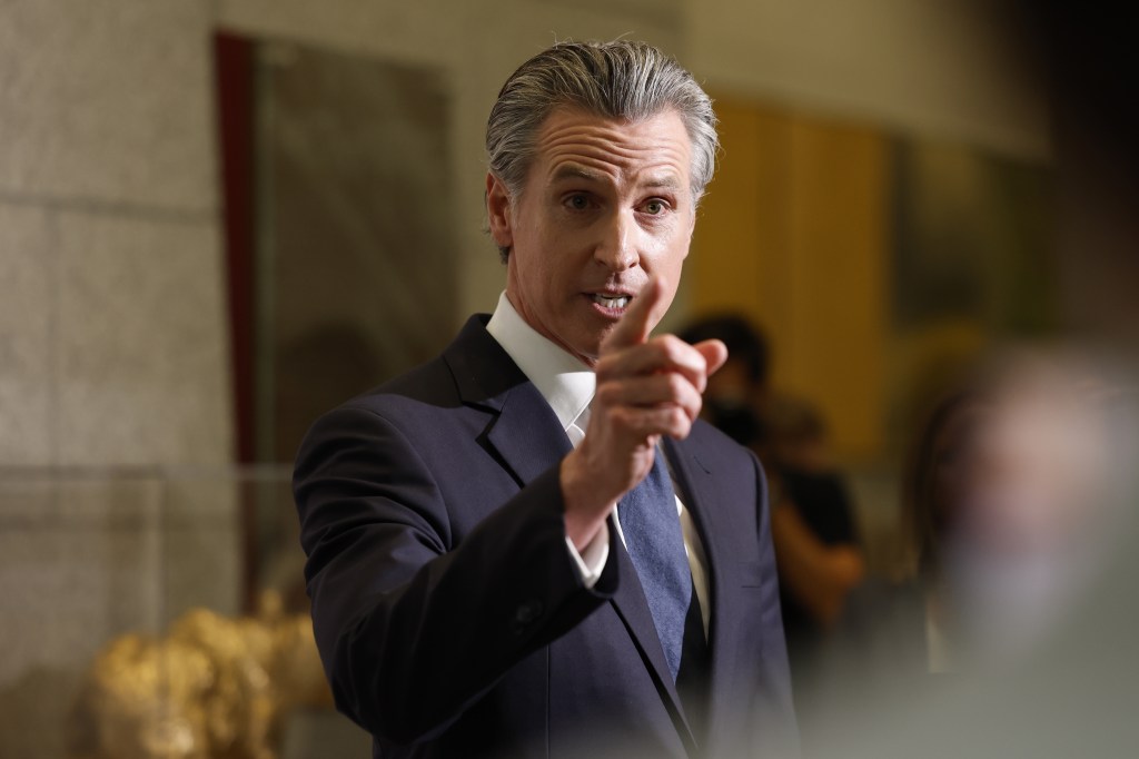 Governor Gavin Newsom speaking at a press conference.