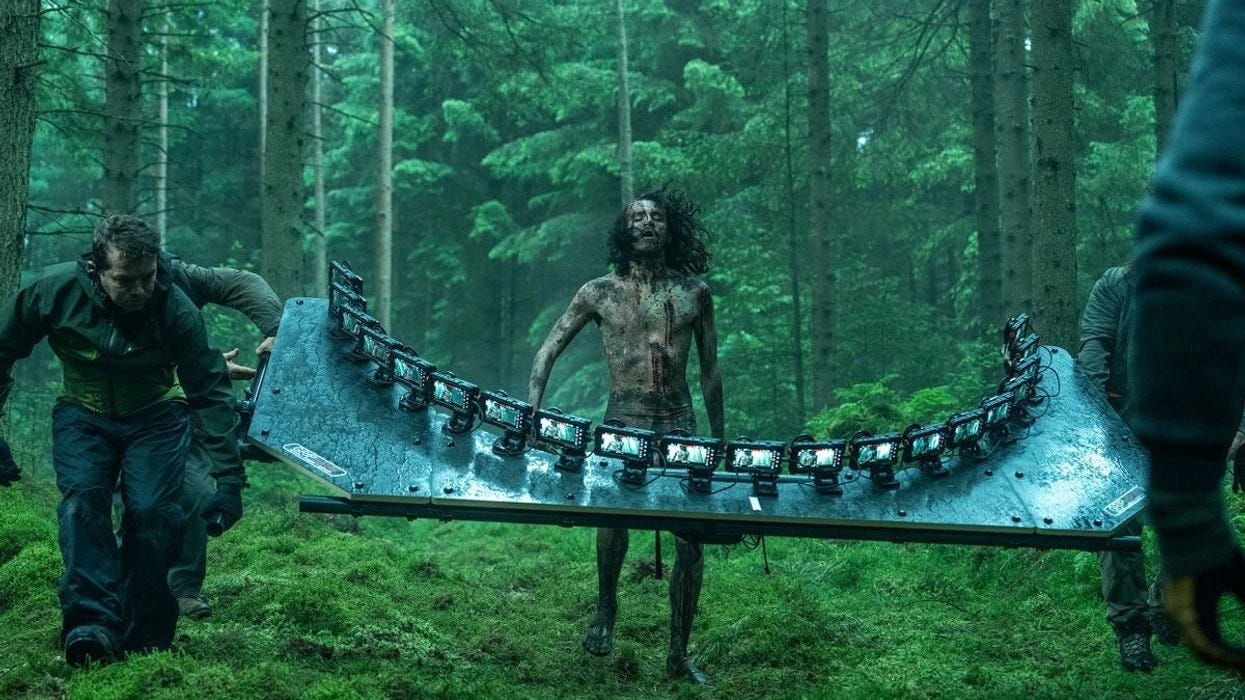 Zombie being filmed with bullet time rig in forest