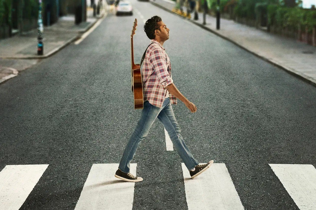 Himesh Patel walking across a street