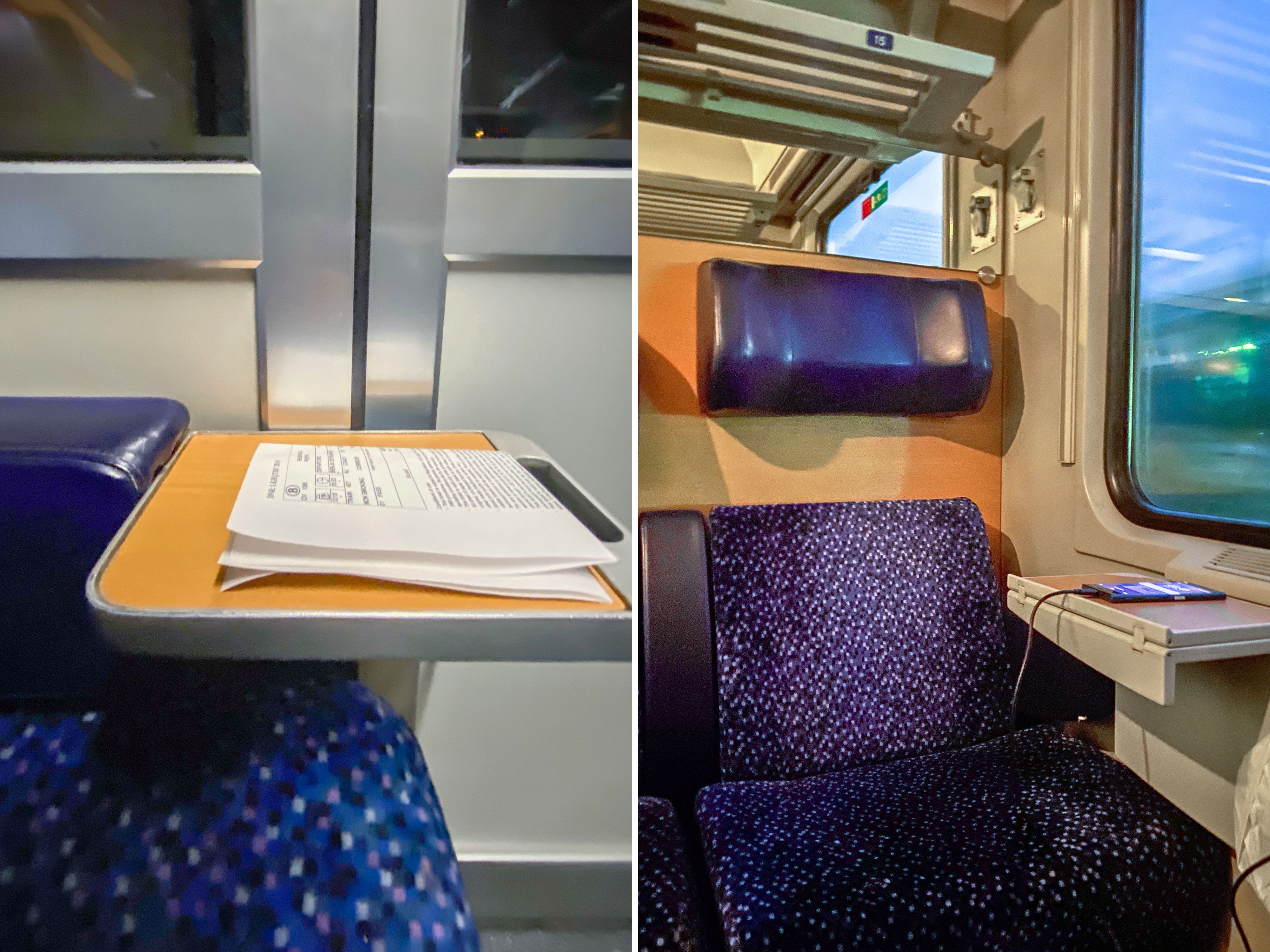 A composite image of a close up of a mini wood table attached to the arm of a blue chair. There are papers on the table. And a plush, blue train seat to the right of a window on a train with a side table holding a charging phone beneath the window.