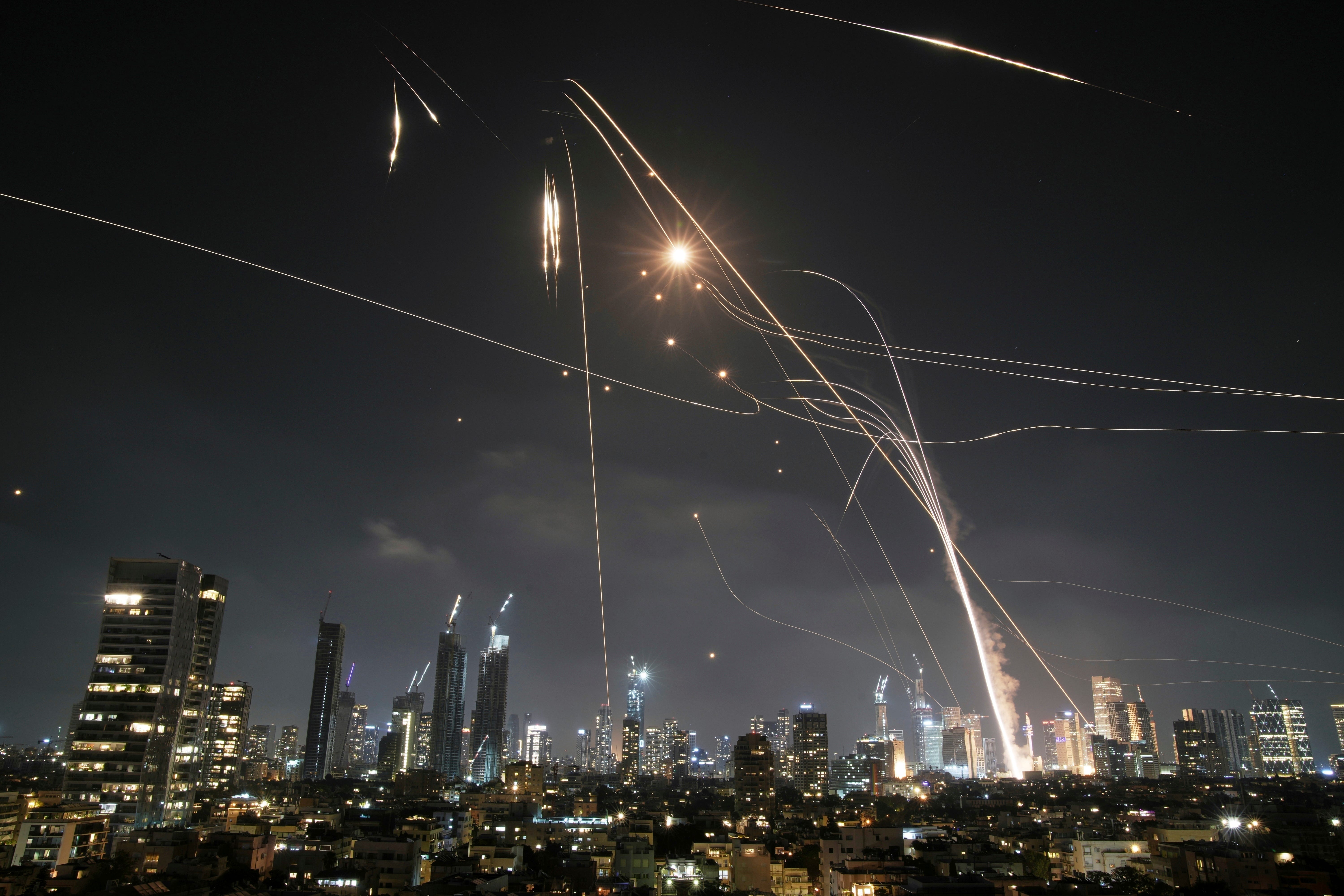 Israeli Iron Dome air defense system fires to intercept missiles over Tel Aviv, Israel, Friday, June 13, 2025.