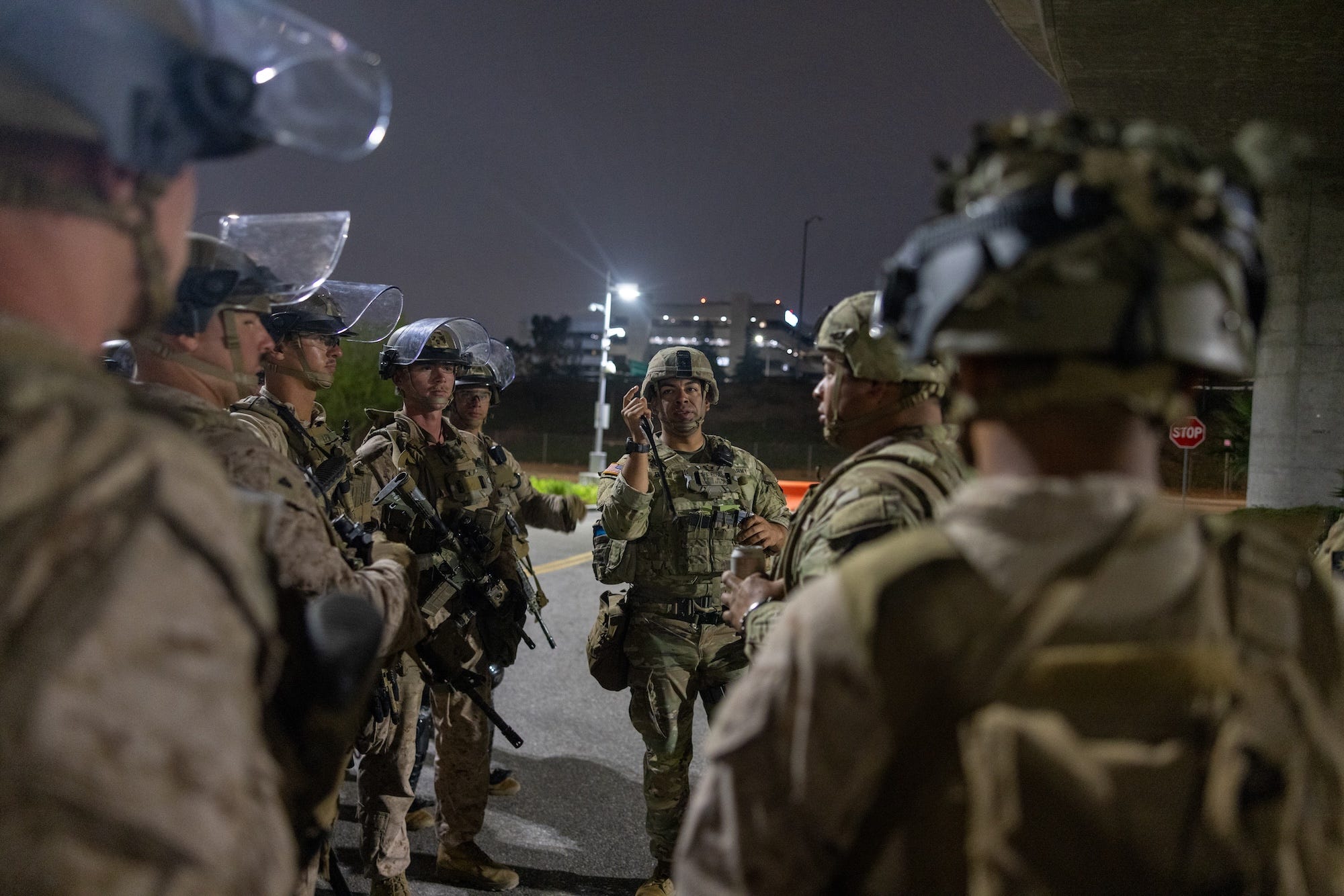 The combat troops of 2nd Battalion, 7th Marines began guarding a federal building in Los Angeles on Thursday night.