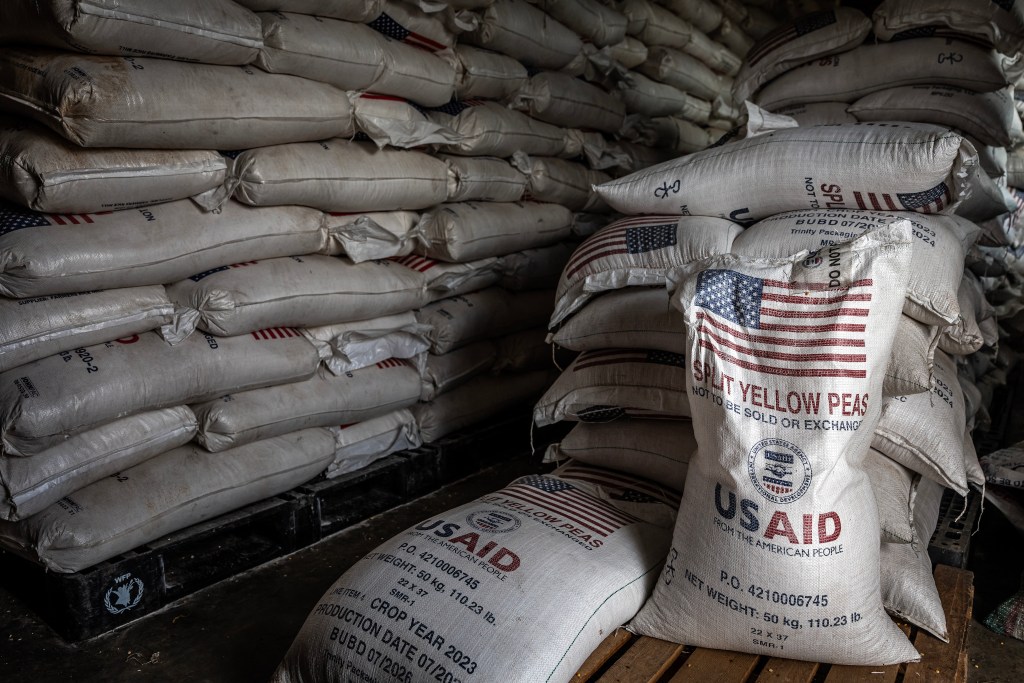 Sacks of USAID yellow peas in a storage facility.