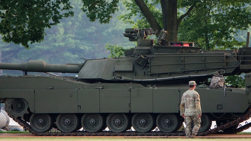 An Army soldier walks near a tank at West Potomac Park in preparation for the Army's 250th Anniversary Parade on June 12, 2025 in Washington, DC, but many Republican lawmakers are not sticking around for the festivities taking place on President Trump's birthday.