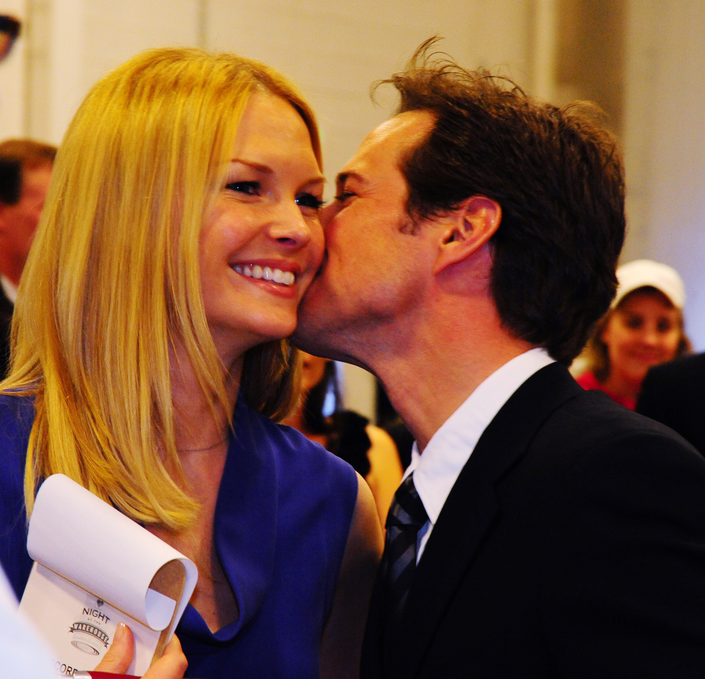 Scott Wolf kisses Kelley Wolf on the cheek. 