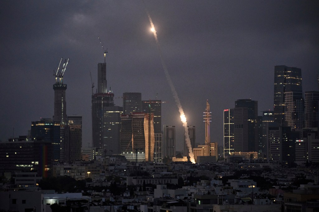 Israel's Iron Dome launches air defense projectiles at Iranian missiles over Tel Aviv on June 14, 2025.