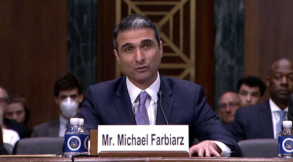 Mr. Michael Farbiarz testifying at a Senate hearing.