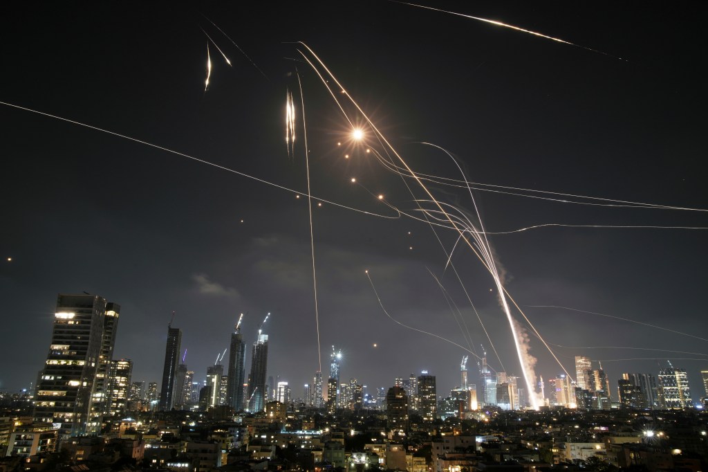 Iron Dome intercepts missiles over Tel Aviv at night.