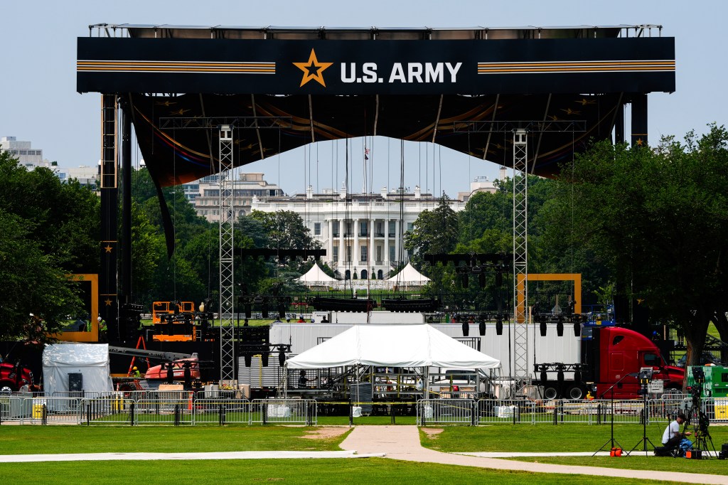 Stage set up for a U.S. Army parade with the White House in the background.