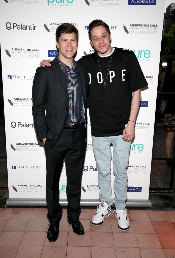 Jost and Davidson posing together smiling at the camera at an event
