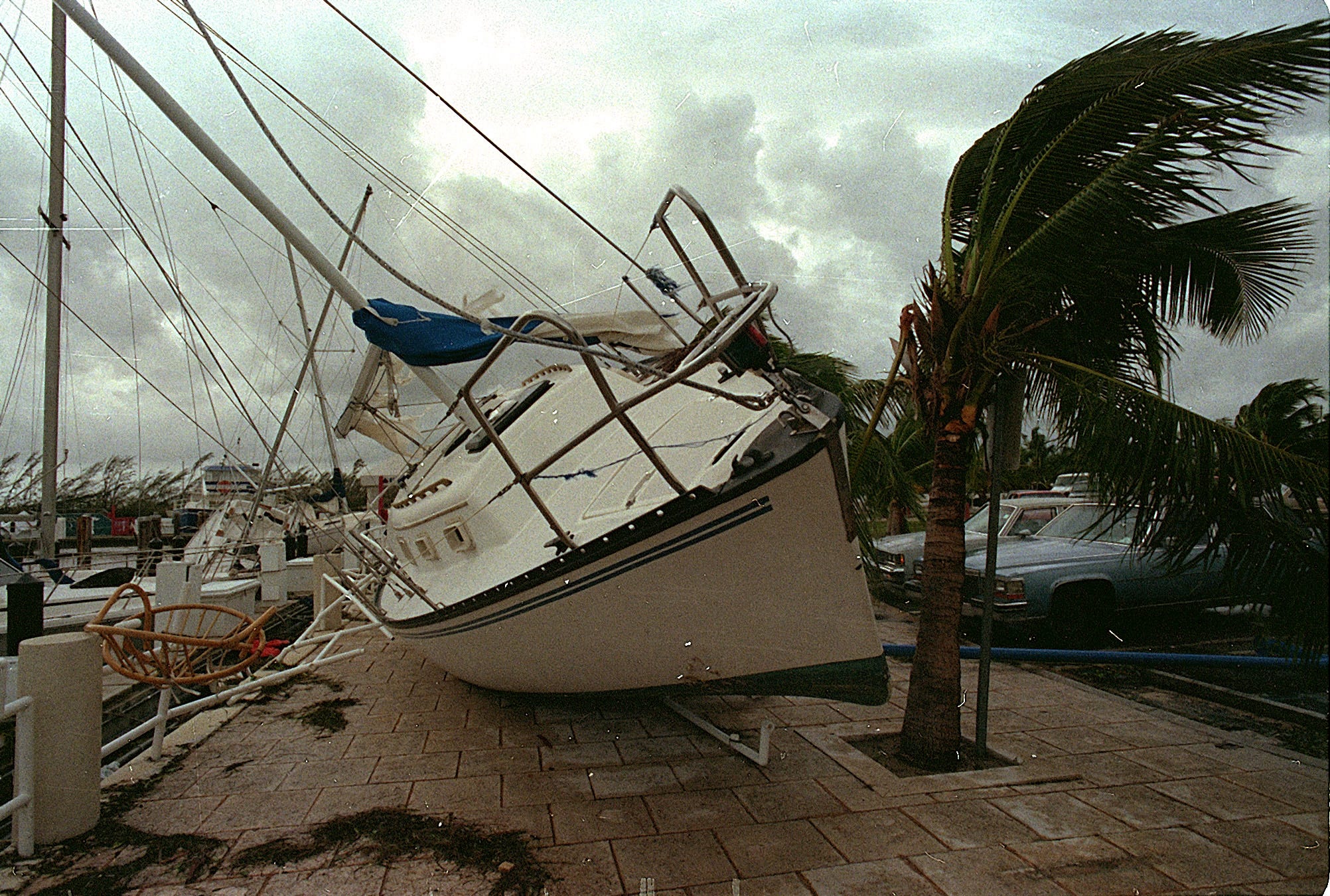 A sailboat washed up on a sidewalk after Hurricane Andrew