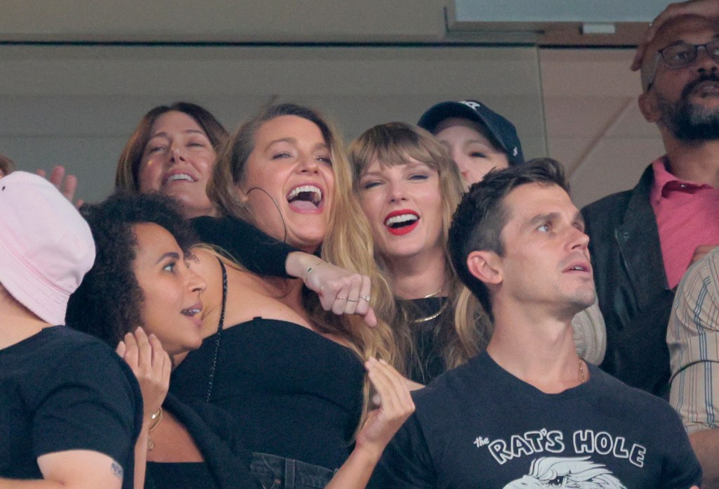 Blake Lively and Taylor Swift at a Chiefs game sitting in a VIP box. 