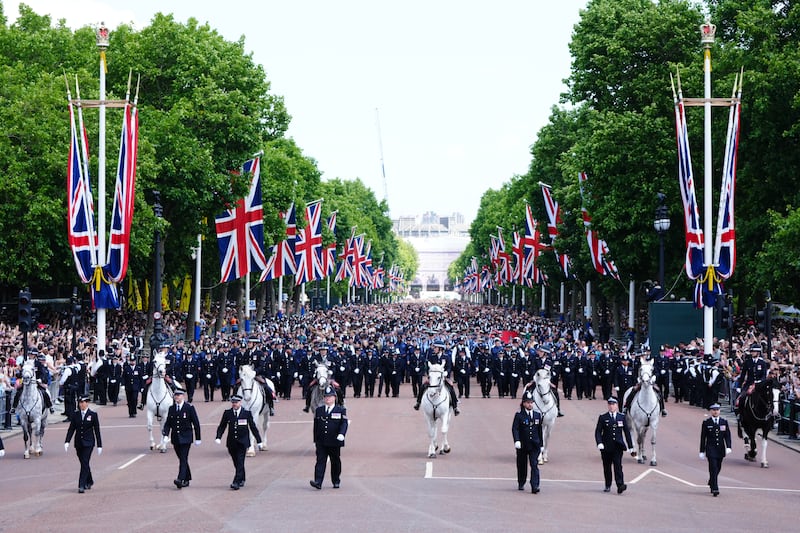 People walk down the Mall after Trooping the Colour ceremony in central London as King Charles III celebrates his official birthday. Picture date: Saturday June 14, 2025. (Photo by Aaron Chown/PA Images via Getty Images)