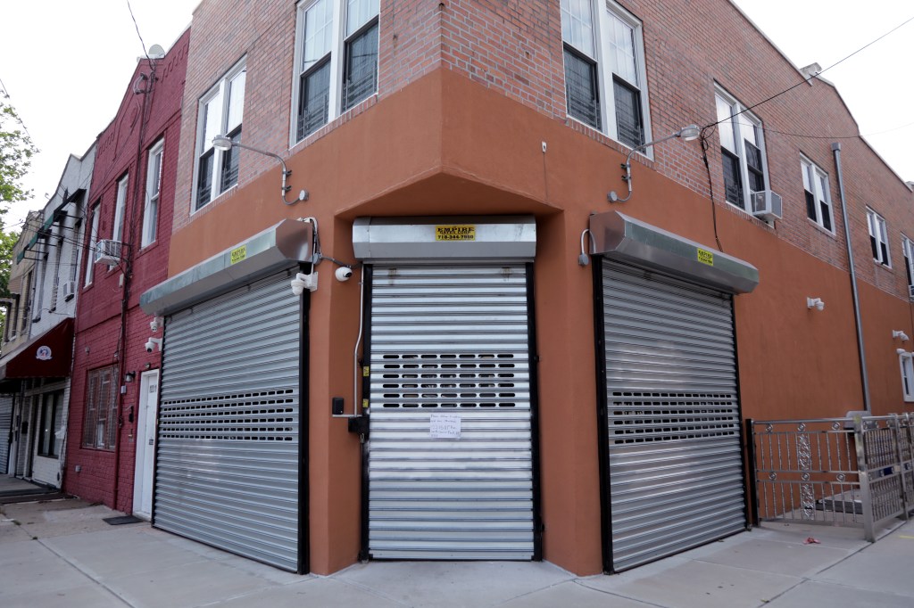 Corner building with security roll-down gates.