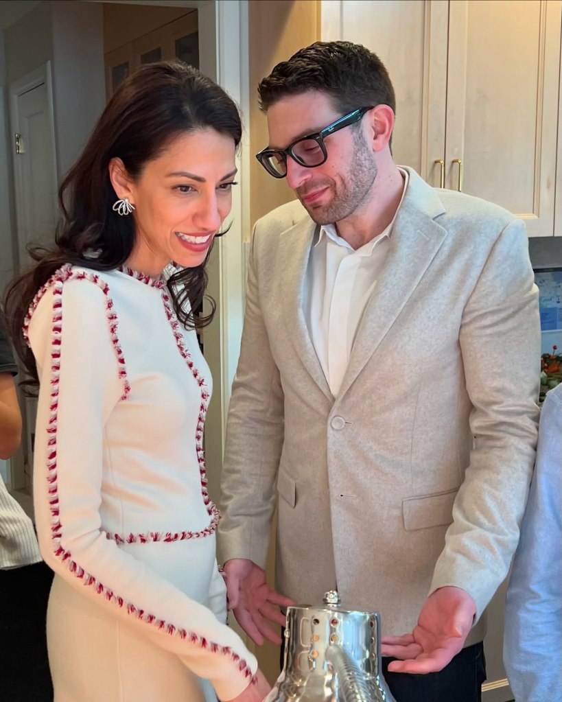 Huma Abedin and Alex Soros standing together. 