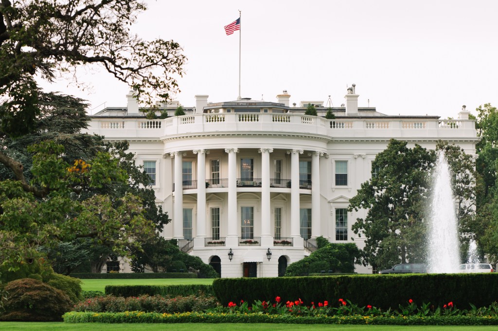The White House with the US flag flying.