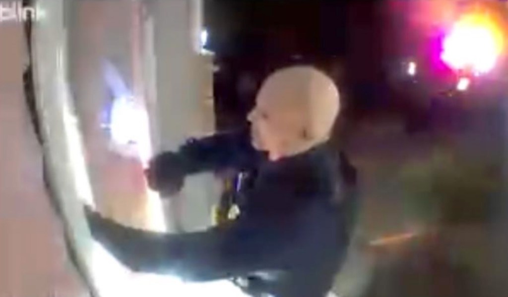 Surveillance image related to the shooting of two democratic lawmprkes in Minnesota show the person of interest believe to be Vance Boelter with a flashlight in front of a door
