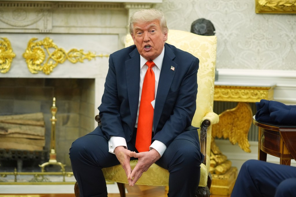 Donald Trump speaking in the Oval Office.
