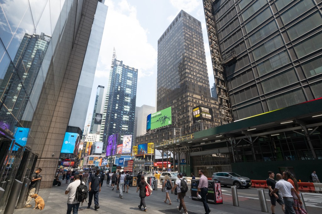 Times Square, New York City street scene with pedestrians and skyscrapers.