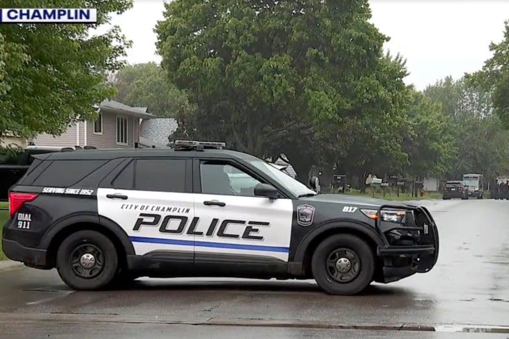 A Champlin police car blocks the road to the Hoffmans home after the shooting on June 14, 2025. 
