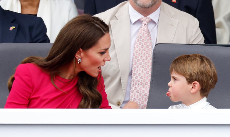 LONDON, UNITED KINGDOM - JUNE 05: (EMBARGOED FOR PUBLICATION IN UK NEWSPAPERS UNTIL 24 HOURS AFTER CREATE DATE AND TIME) Prince Louis of Cambridge sticks his tongue out at his mother Catherine, Duchess of Cambridge as they attend the Platinum Pageant on The Mall on June 5, 2022 in London, England. The Platinum Jubilee of Elizabeth II is being celebrated from June 2 to June 5, 2022, in the UK and Commonwealth to mark the 70th anniversary of the accession of Queen Elizabeth II on 6 February 1952. (Photo by Max Mumby/Indigo/Getty Images)