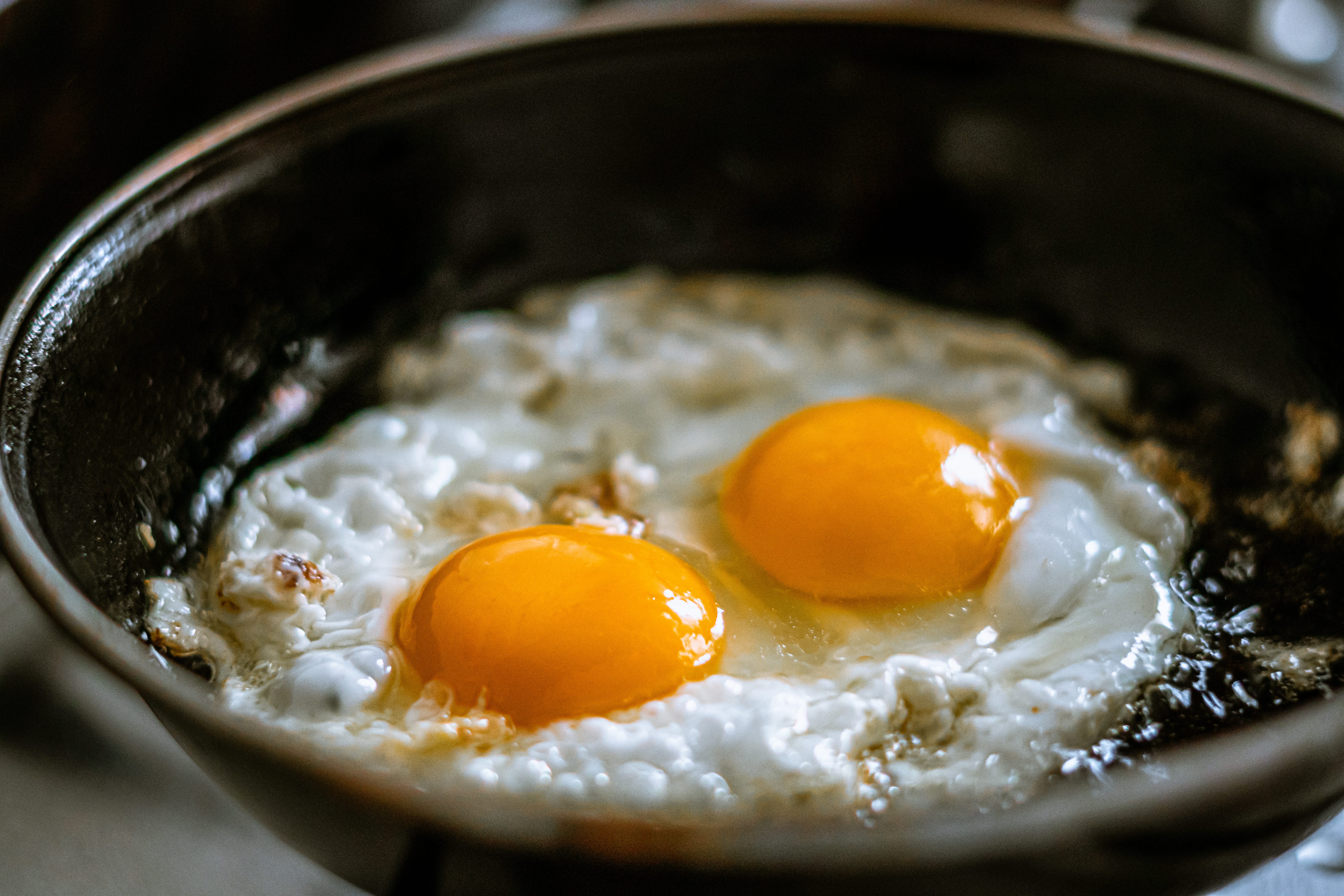 Eggs frying in pan