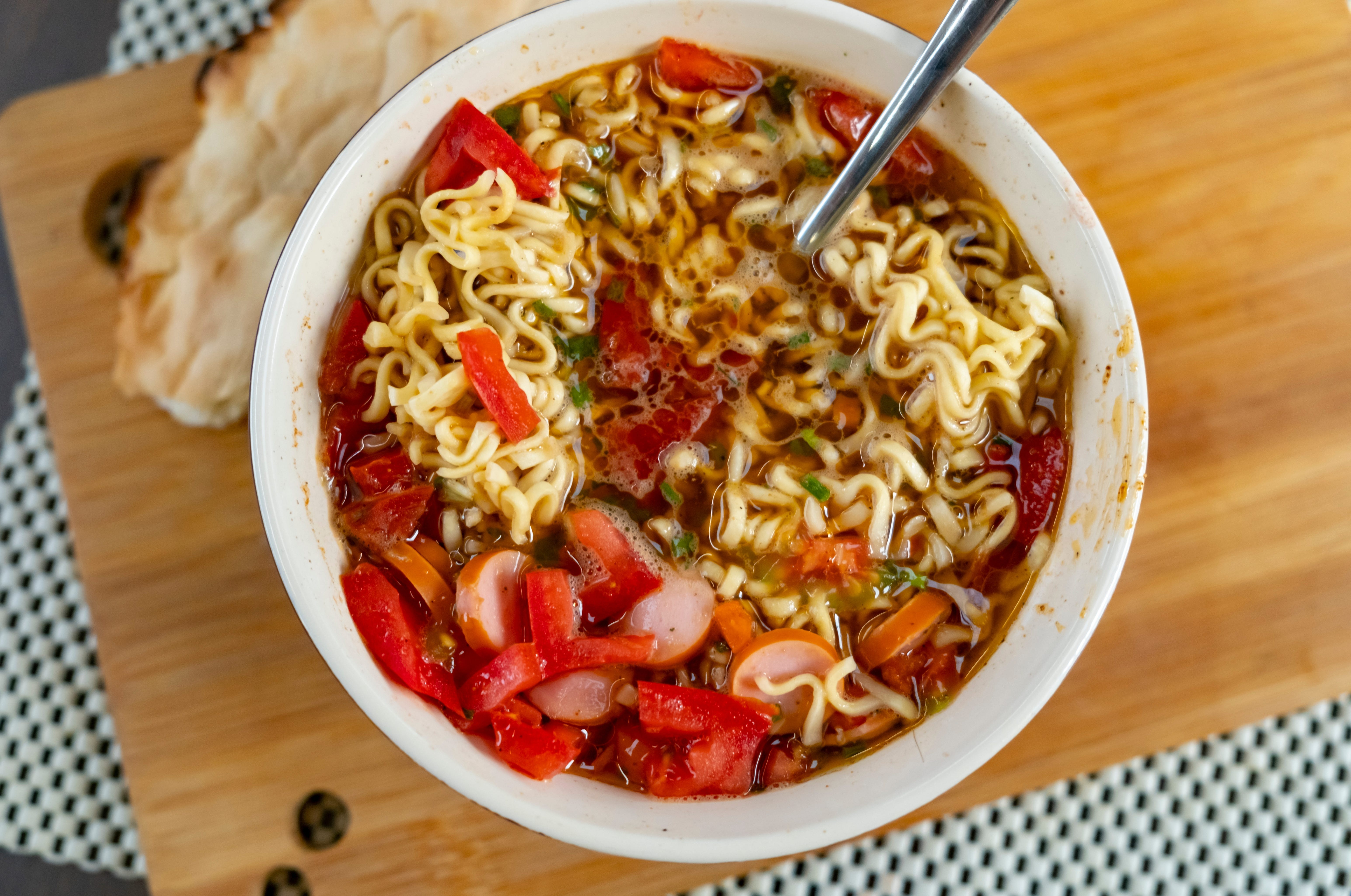 Cup of noodles with sausage, peppers