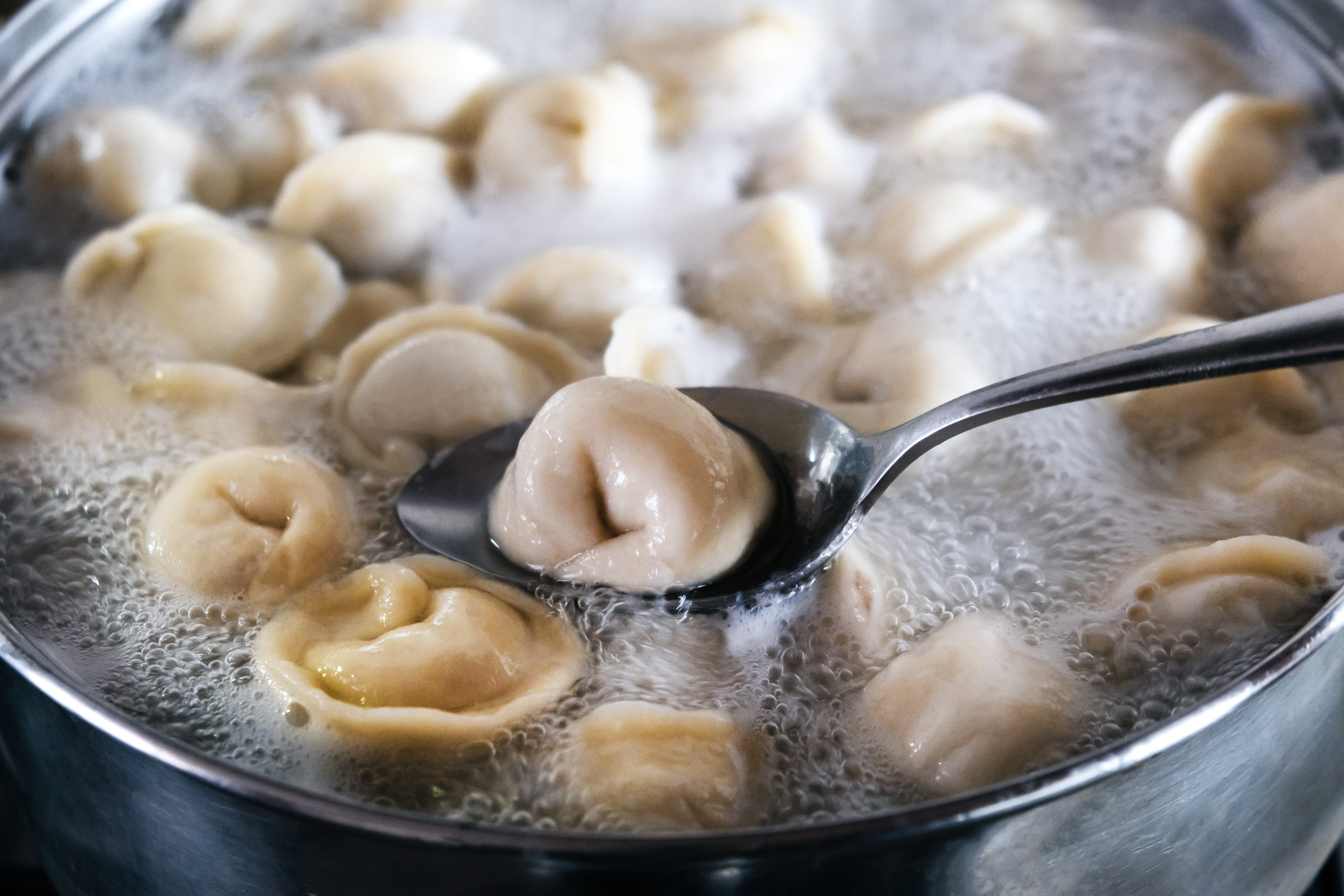 Dumplings being boiled in water