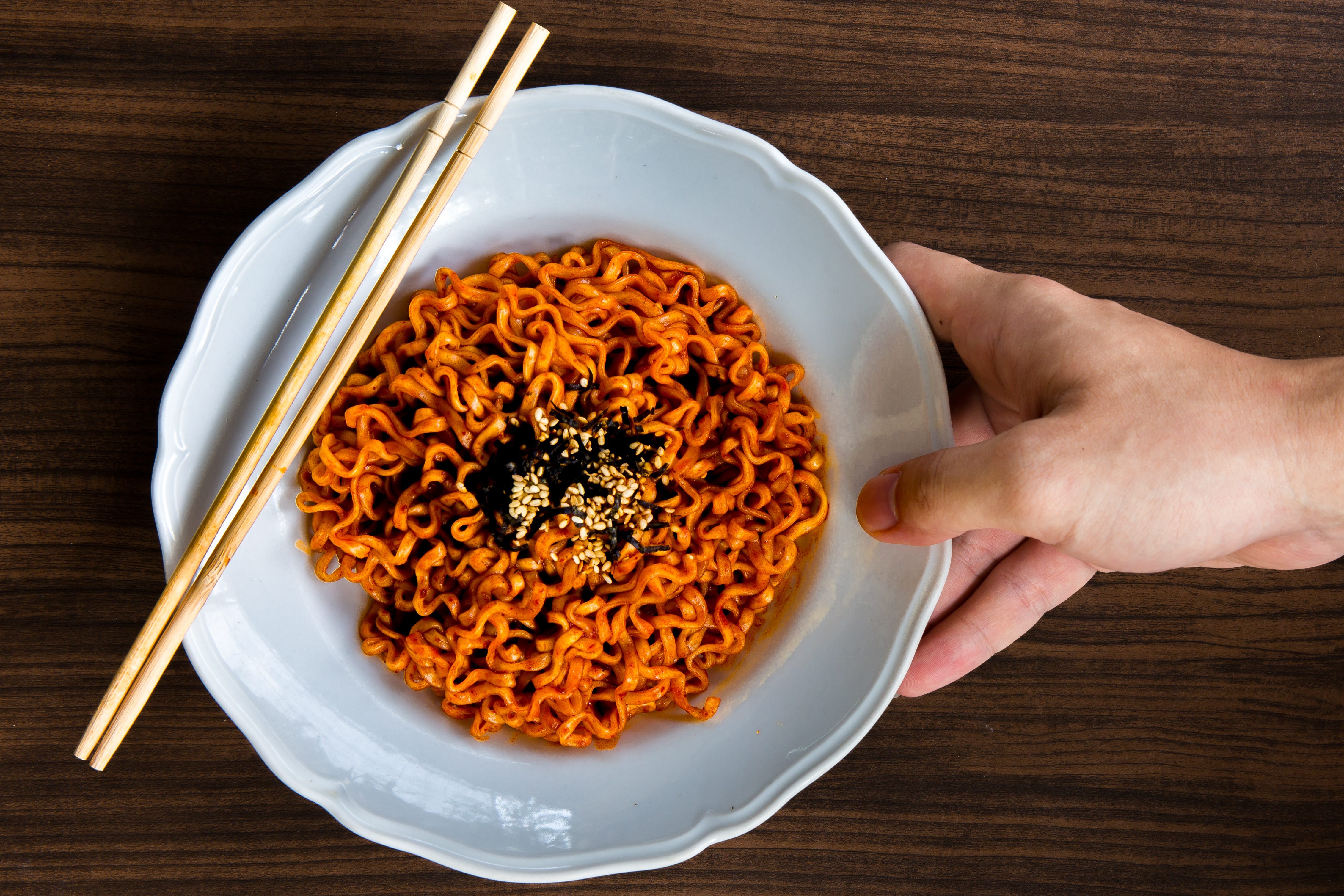 Noodles with sauce and sesame seeds on top