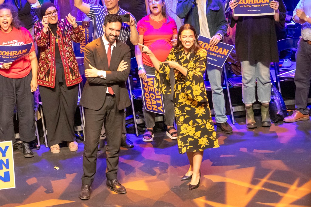 NYC mayoral candidate Zohran Mamdani at a rally with supporters.