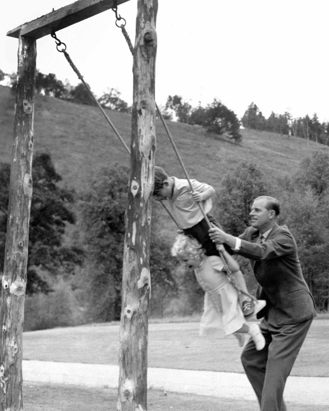 Princess Anne, King Charles, Prince Philip playing