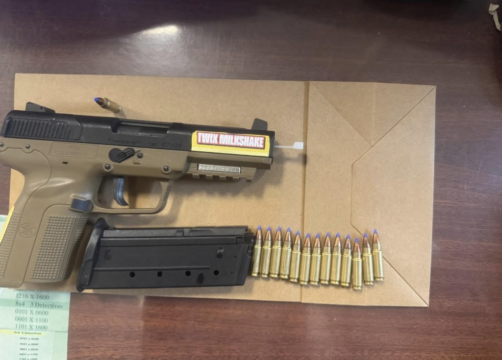 Handgun and magazine with bullets confiscated by New York State Supreme Court officers.