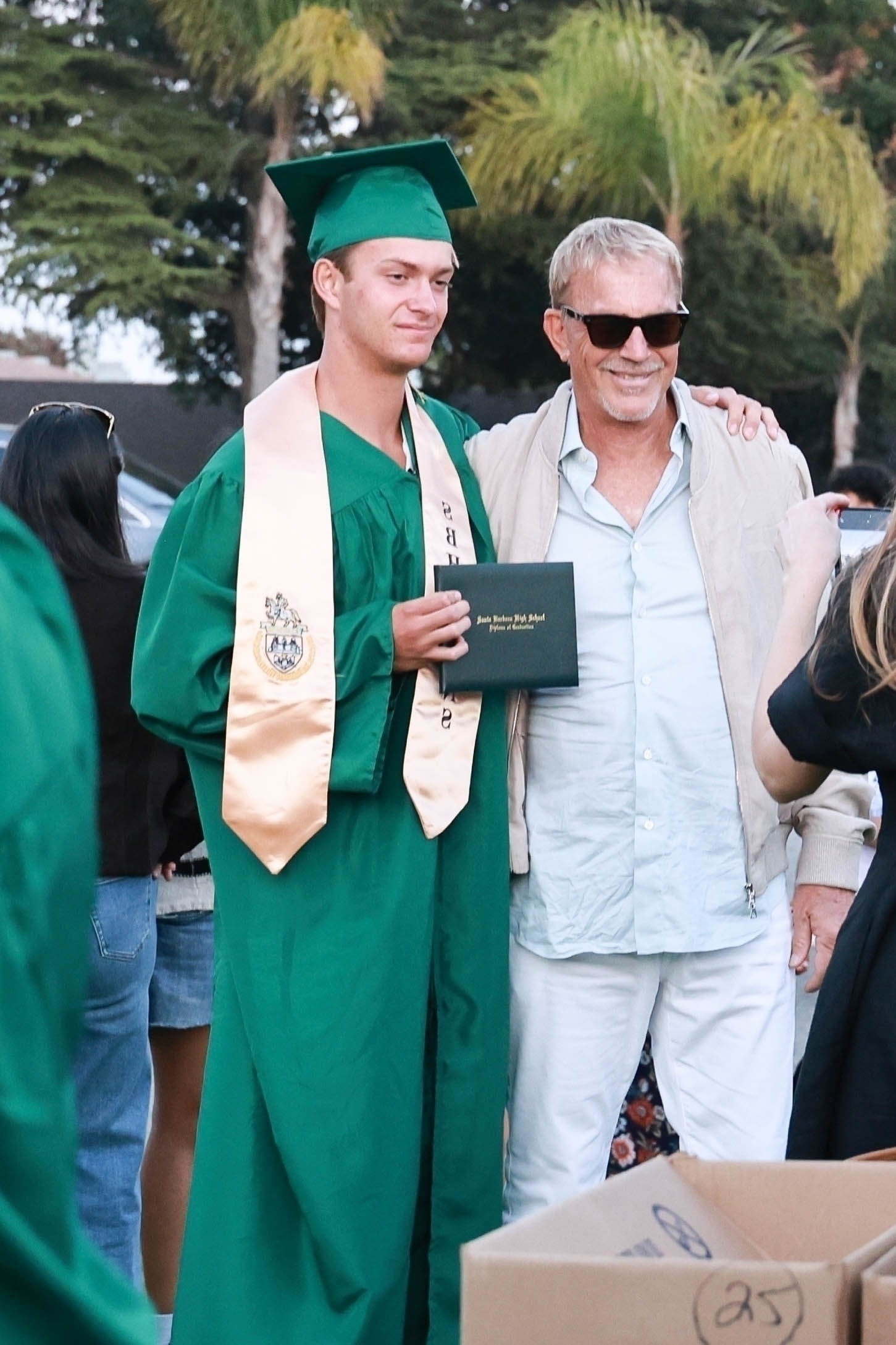 Kevin Costner and his son Cayden at the teen's high school graduation.