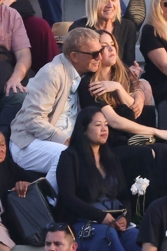 Kevin Costner and his daughter Lily at Cayden's graduation 